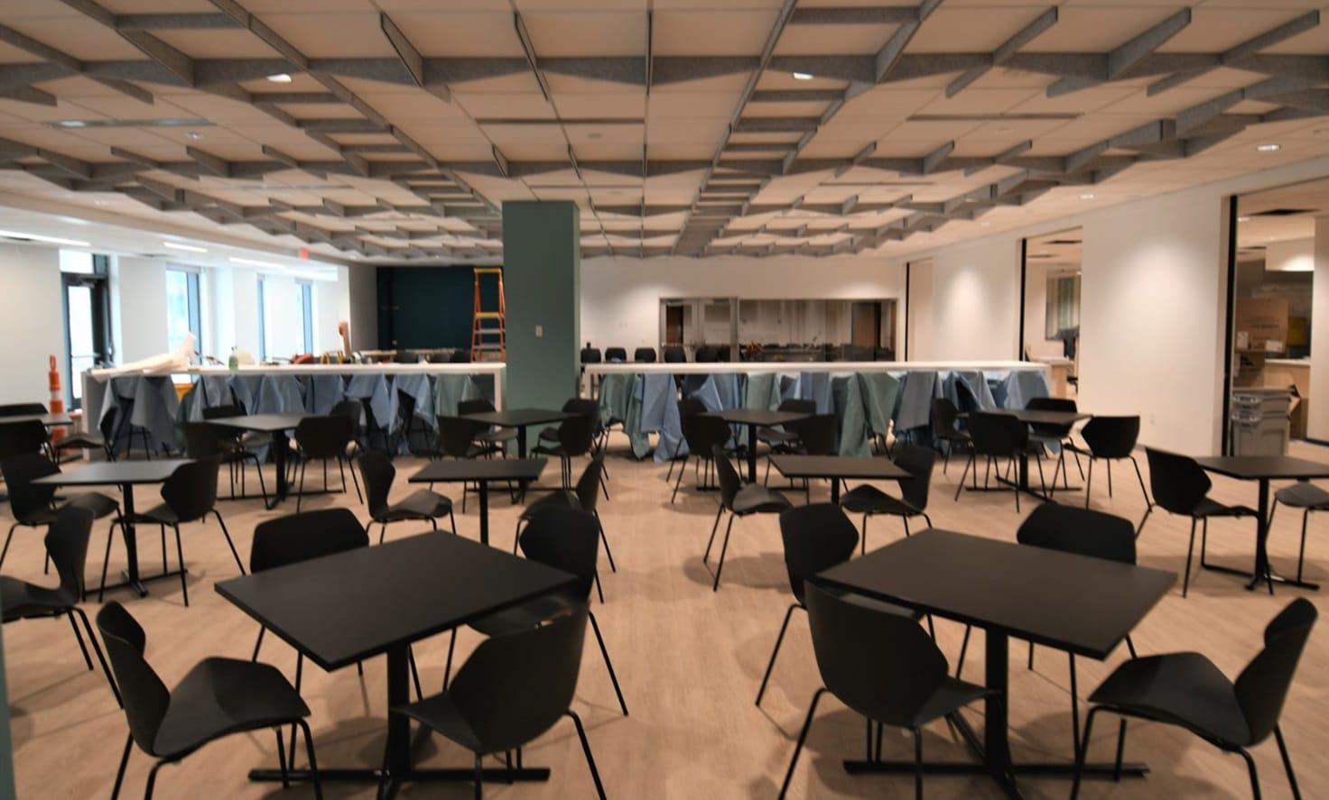 Furnishings and equipment continued to be staged across the building, including dining room seating and a variety of meeting-space furniture. (Photo by NGA)