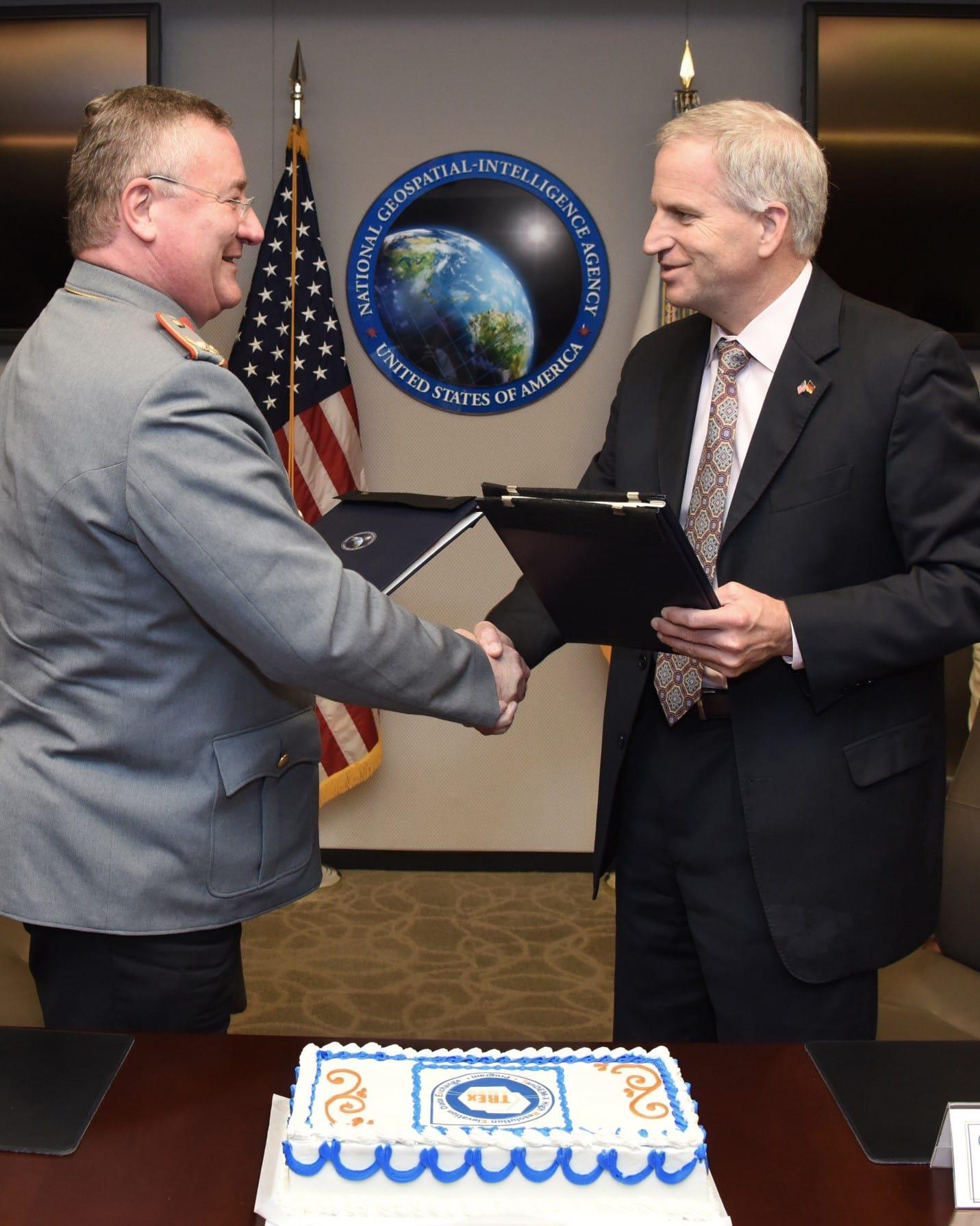 NGA Director Robert Cardillo and BGIC Director Brigadier General Roland Brunner sign TanDEM-X High Resolution Elevation Data Exchange agreement Dec. 14. Photo by Tony Boone, NGA Office of Corporate Communications.